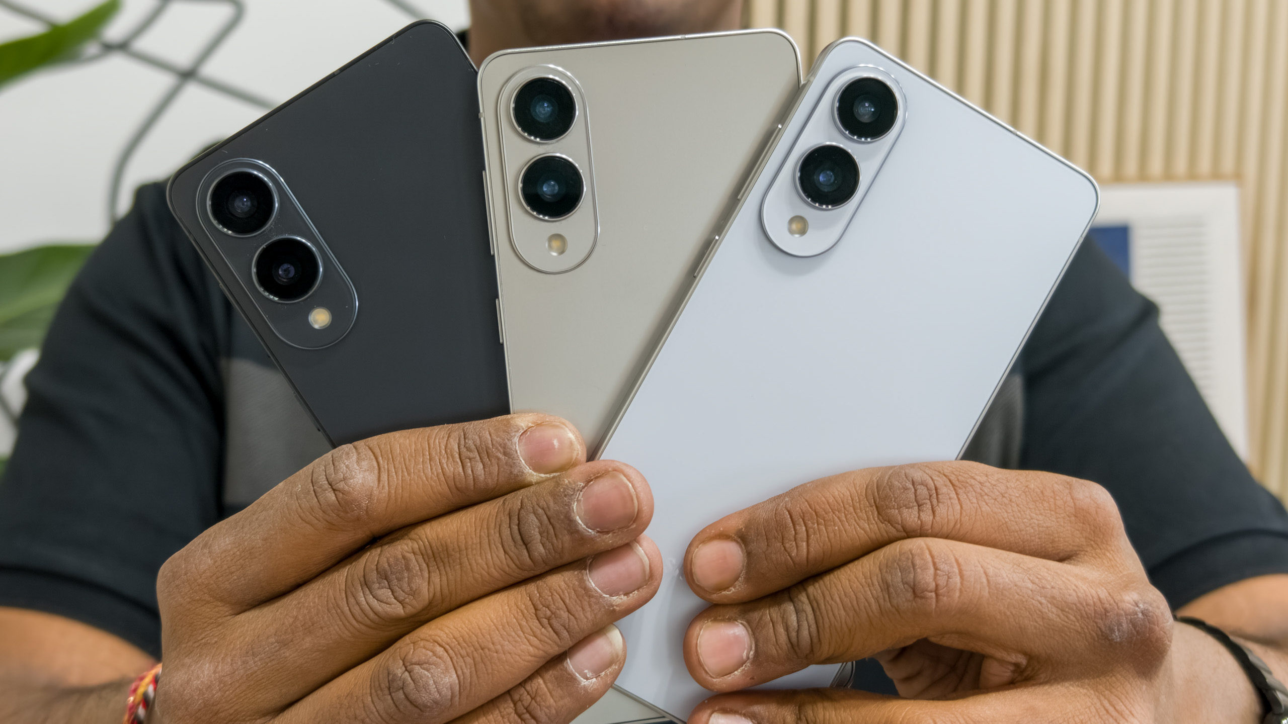 Holding the Galaxy S25 Edge in all three colors